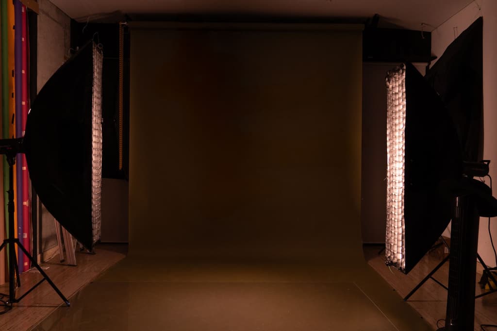Photography studio with two softboxes facing a backdrop